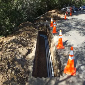 Power and data conduit being installed in the Arroyo Section