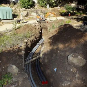 Power and data conduit being installed in the Arroyo Section