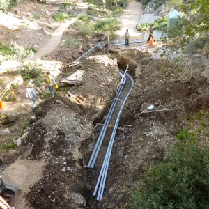 Power and data conduit being installed in the Arroyo Section, view from office deack looking south
