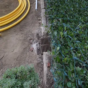 Courtyard renovation, rerouting piping, east edge looking north
