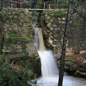 Visitor observing Mission Dam waterfall
