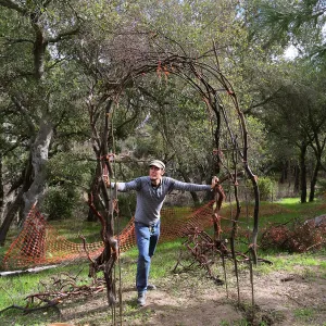 Adam Kuster constructring arch for the Centennial Maze