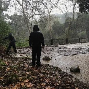Debris accumulation at Mission Dam during rainstorm