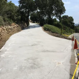 Light colored ecosealant on driveway heading to Pritzlaff Conservation Center