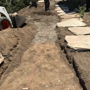 Constructing stone pathway on east side of the Pritzlaff Conservation Center
