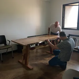 Steve Windhager and Sven Nebelung with new table for director's office