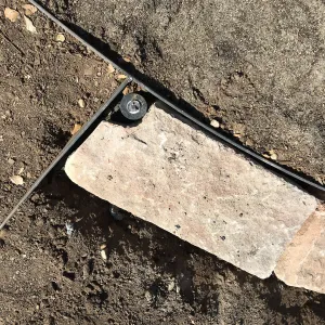 Construction of stone edging in Island View Garden lawn