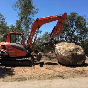 Boulder at Hansen site moved prior to Horticulture Barn construction