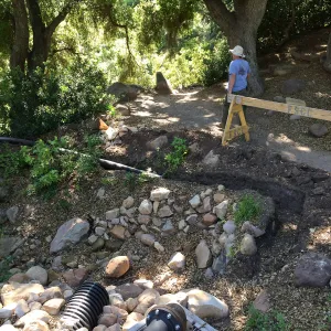 Installation of runoff collection pipe connection from Pritzlaff Conservation Center to well tank