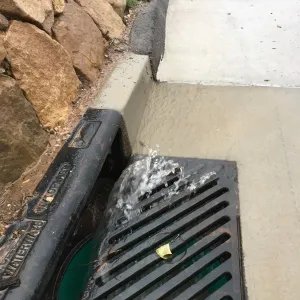 Drain on driveway that funnels water to rill at the Pritzlaff Conservation Center