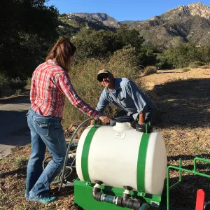 Testing the Hydroseeder.Denise Knapp and Robert Carillo
