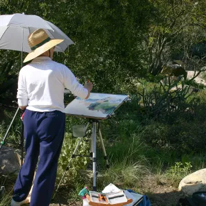 Artist painting at Pond