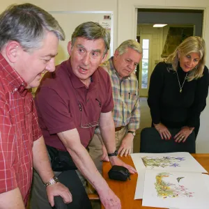 Ed Schneider, Patick O'Hara, Bob Sherwood, and Nancy Johnson viewing artwork