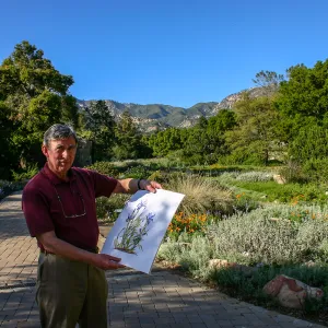 Patick O'Hara with his painting â€œIris and Lilyâ€