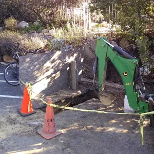 Irrigation water line repair in main parking lot, just south of the bike rack, looking northeast