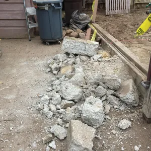 Repair of Garden Growers Lath House. Removing concrete step