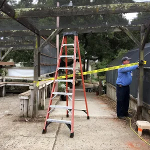 Repair of Garden Growers shade structure, looking south