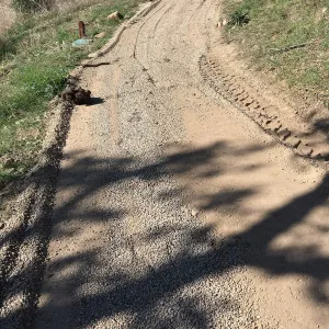 Gravel treatment to cart trail on west side of PCC