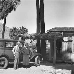 Thousand Palms, auto, man woman, buidings, palms