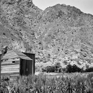 Indio, shack next to mountain