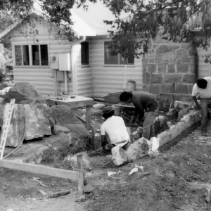 Construction of stone planters, in front of Cottage, for the Home Demonstration Garden