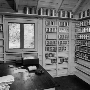 The historic 'Seed Room', seeds stored in metal cans arranged on wall shelves
