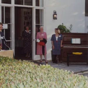 Piano and ladies in front of Blaksley Library