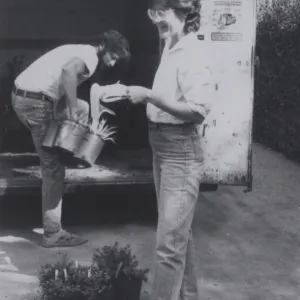Plant Propagator Carol Bornstein prepares for plant sale, October 1984