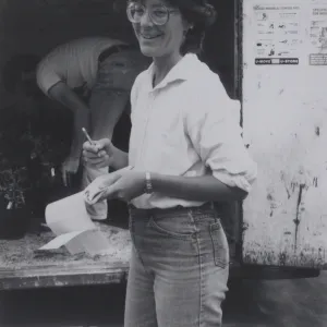 Plant Propagator Carol Bornstein prepares for plant sale, October 1984