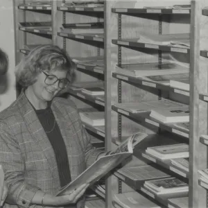 Librarian Becky Eldridge with Library patron in Library Annex