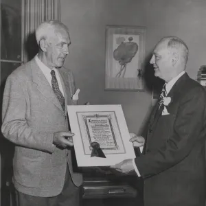 Sellar Bullard accepting Senora Dona plaque from Mayor Norris Montgomery