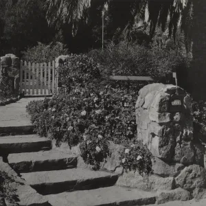 Mailbox set into sturdy stone structure that blends into wall & steps, Hope Ranch home