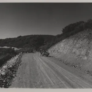 Sierra Madre Road soon after construction, jeep with field researchers
