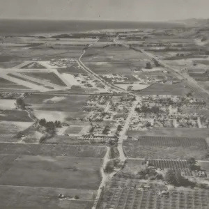 Aerial view of old town Goleta, airport, 101 freeway, and surrounding farms