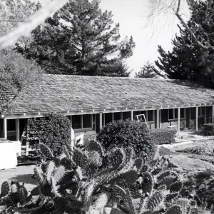 Early stages in the construction of a new building to house a public information office and laboratories on the upper level and seed and tool storage rooms below.