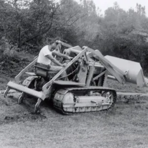 Miscellaneous Grounds Work, Jose Torres uses the new tractor to break up soil in the meadow border