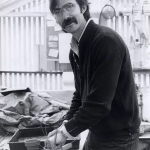 Volunteers - Garden Growers, Garden Grower Sean Hutchinson prepares for plant sale, repotting plants