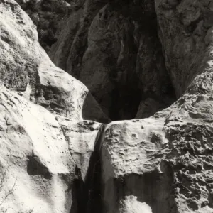 Black and white photograph of rock formation.