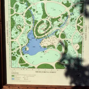 An outdoor map in a wooden frame titled "Plant Directory of the Alice Keck Park Memorial Garden."