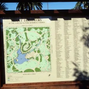 An outdoor map and lengthy directory in a wooden frame titled "Plant Directory of the Alice Keck Park Memorial Garden." 