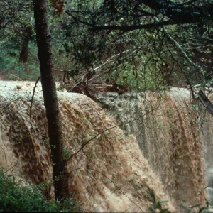 Torrential flooding of Mission Creek over Mission Dam