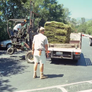 tractor unloading sod for the new Meadow lawn Installation