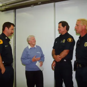 Cherie Bratt talks with local fire fighters during a drill