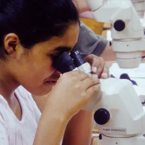girl using microscope, microscope lab