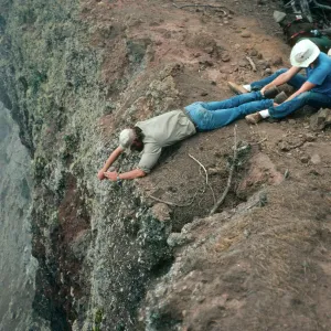 Guadalupe Island, lassoing plants, West of pines at North end of island, Steve Timbrook held by Peter Schuyler